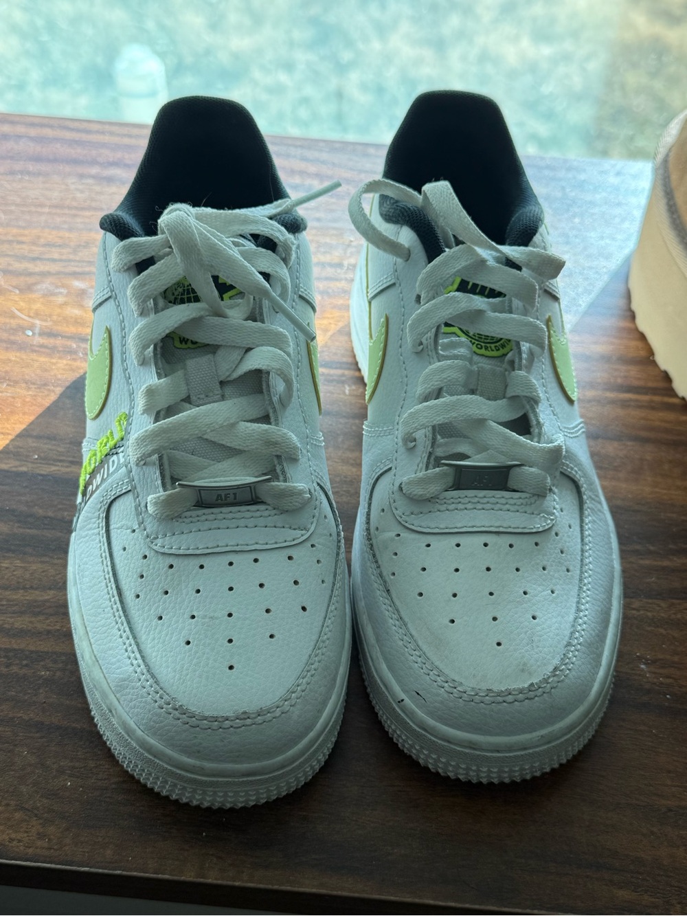 Women’s black and green nike shoes